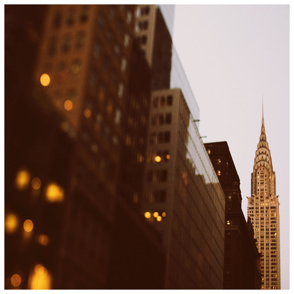 Night falls upon New York and the Chrysler Building. 